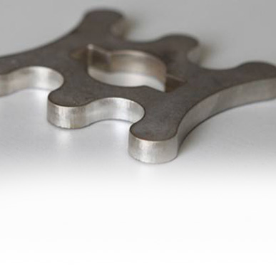 Ground custom metal part with smooth edges and improved surface quality