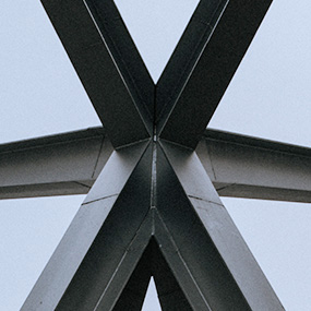 Welded steel frame structure for custom fabrication and load-bearing assembly