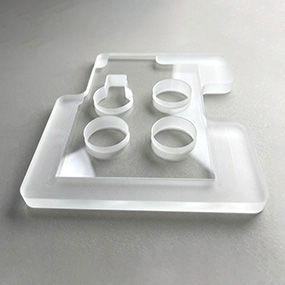 Custom shaped glass part produced by precision glass cutting