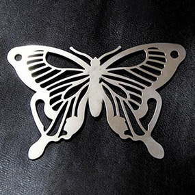 Laser cleaned decorative metal part with detailed surface pattern