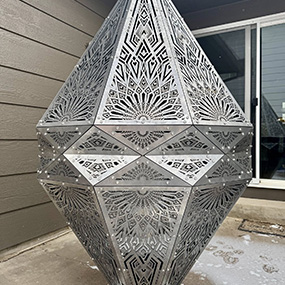 Custom cut acrylic display structure used with metal fabrication projects