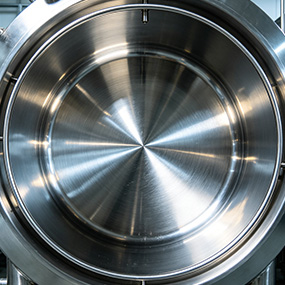 Mirror polished stainless steel component with smooth reflective surface for precision industrial parts