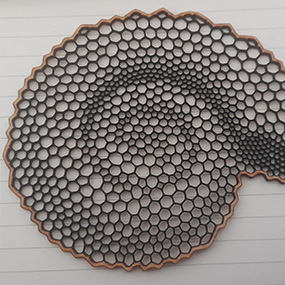 Precision laser cut perforated metal disc for industrial applications