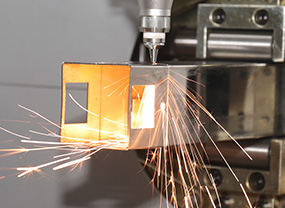 In-house laser cutting equipment for stable metal part production