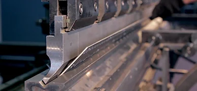 CNC press brake bending an electrical enclosure panel