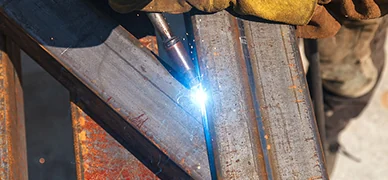 Welding a formed sheet metal electrical enclosure